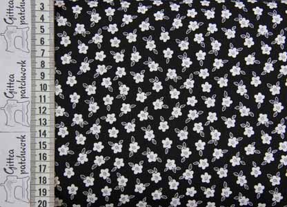 Hvide blomster p sort baggrund